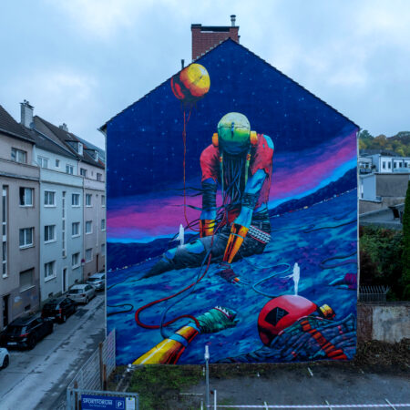 Imagen de un edificio con un mural de 50x70cm